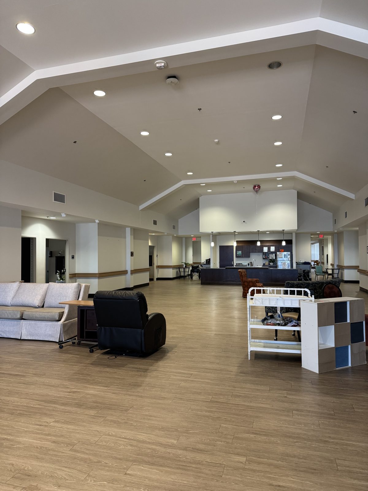 Spacious commercial common area with vaulted ceiling, freshly painted