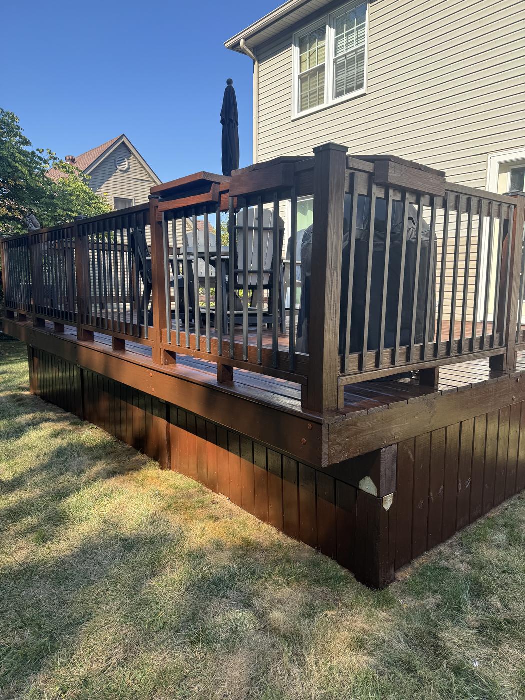 Wood deck with modern black railings freshly finished
