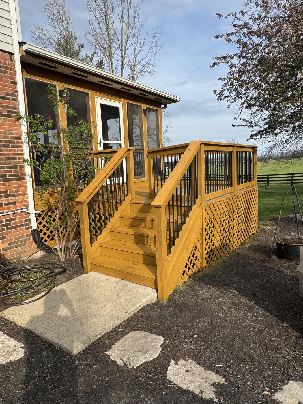 Deck and screened porch stairs stained a warm golden tone