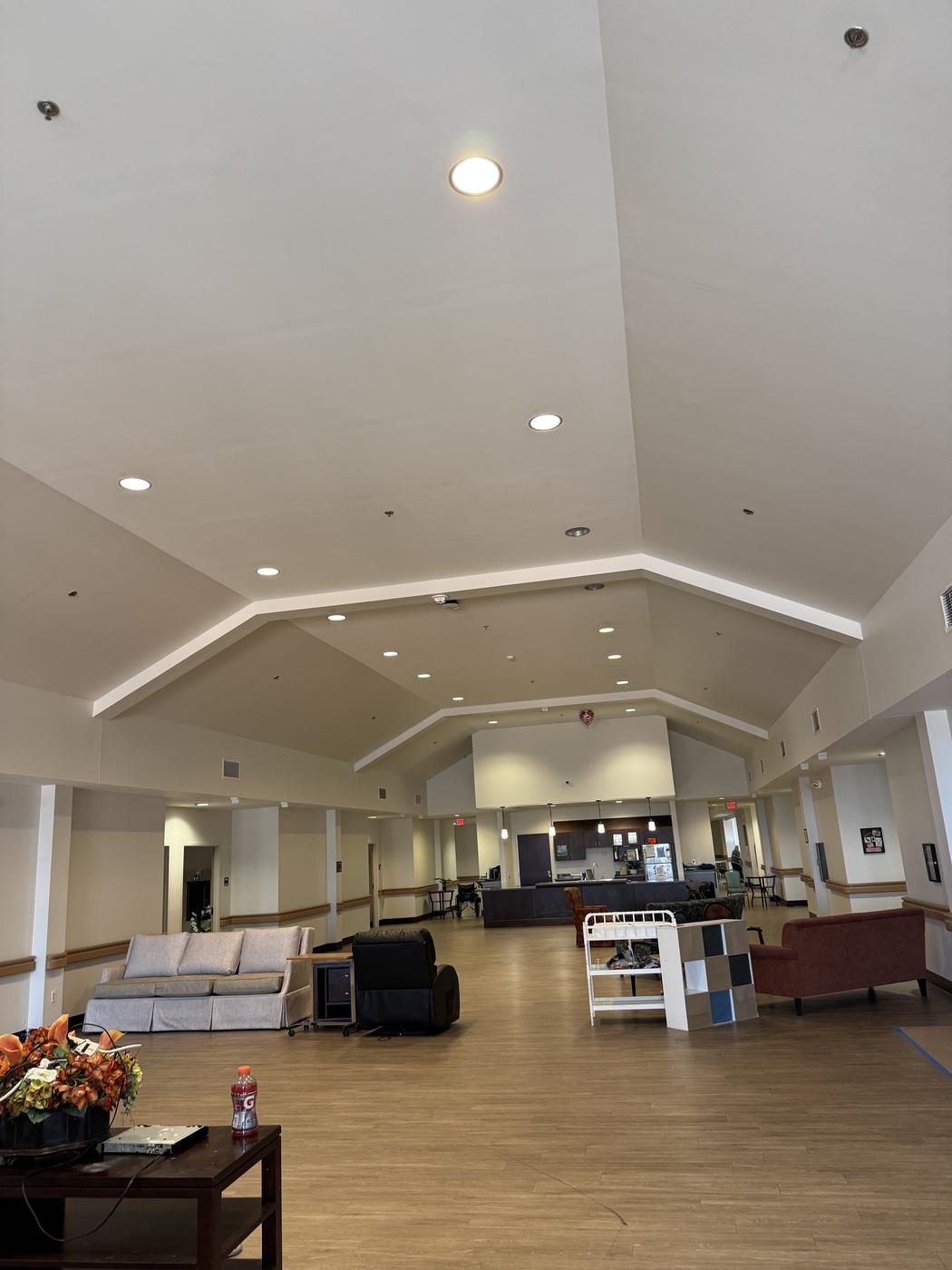 Spacious commercial lobby with vaulted ceiling, freshly painted