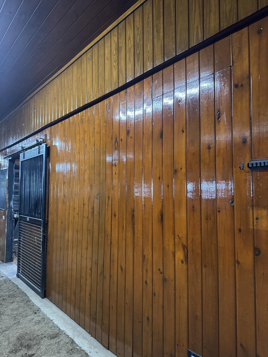 Close-up of glossy freshly stained wood paneling