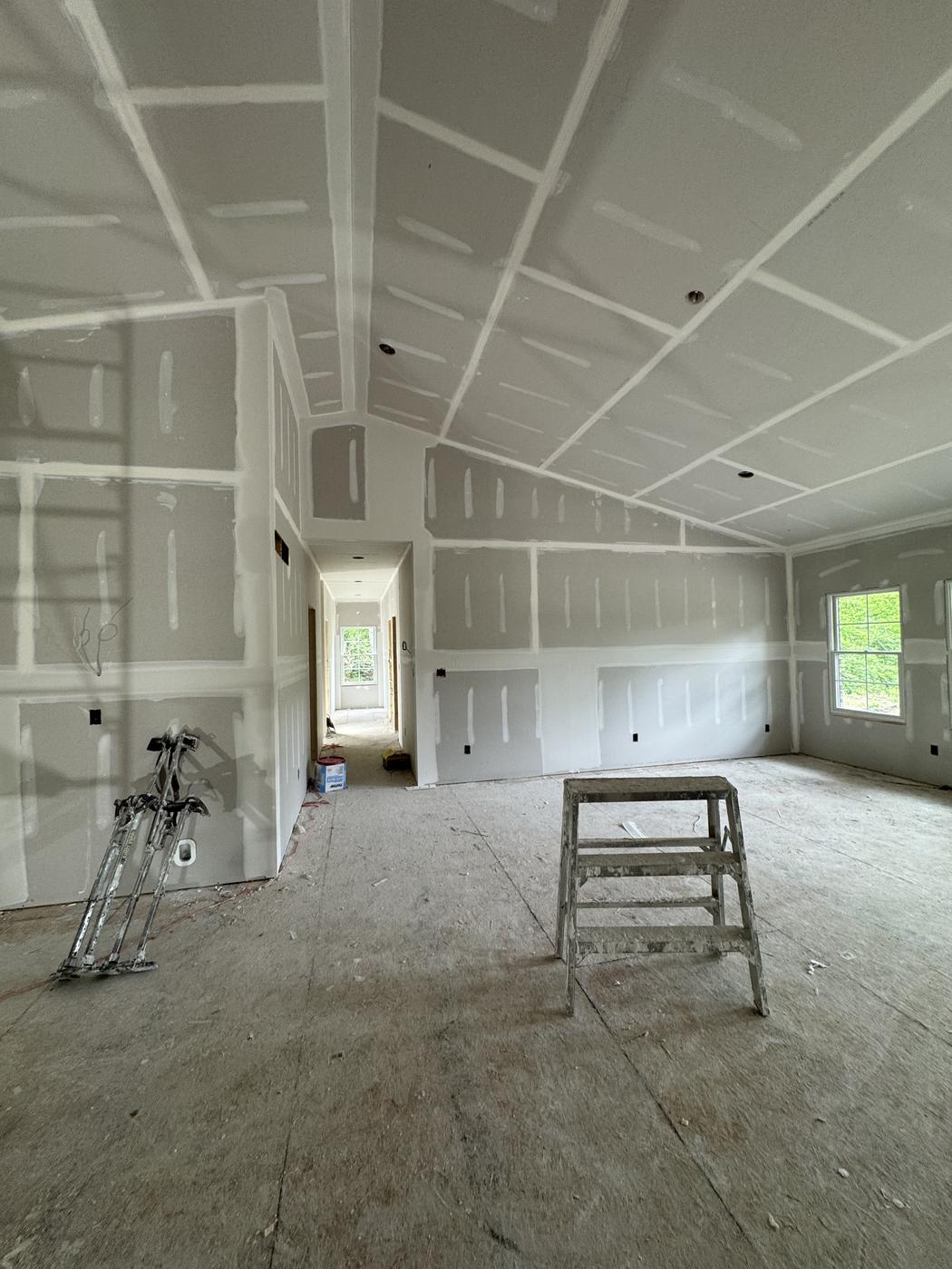 Vaulted ceiling drywall installed and taped, ready for finishing