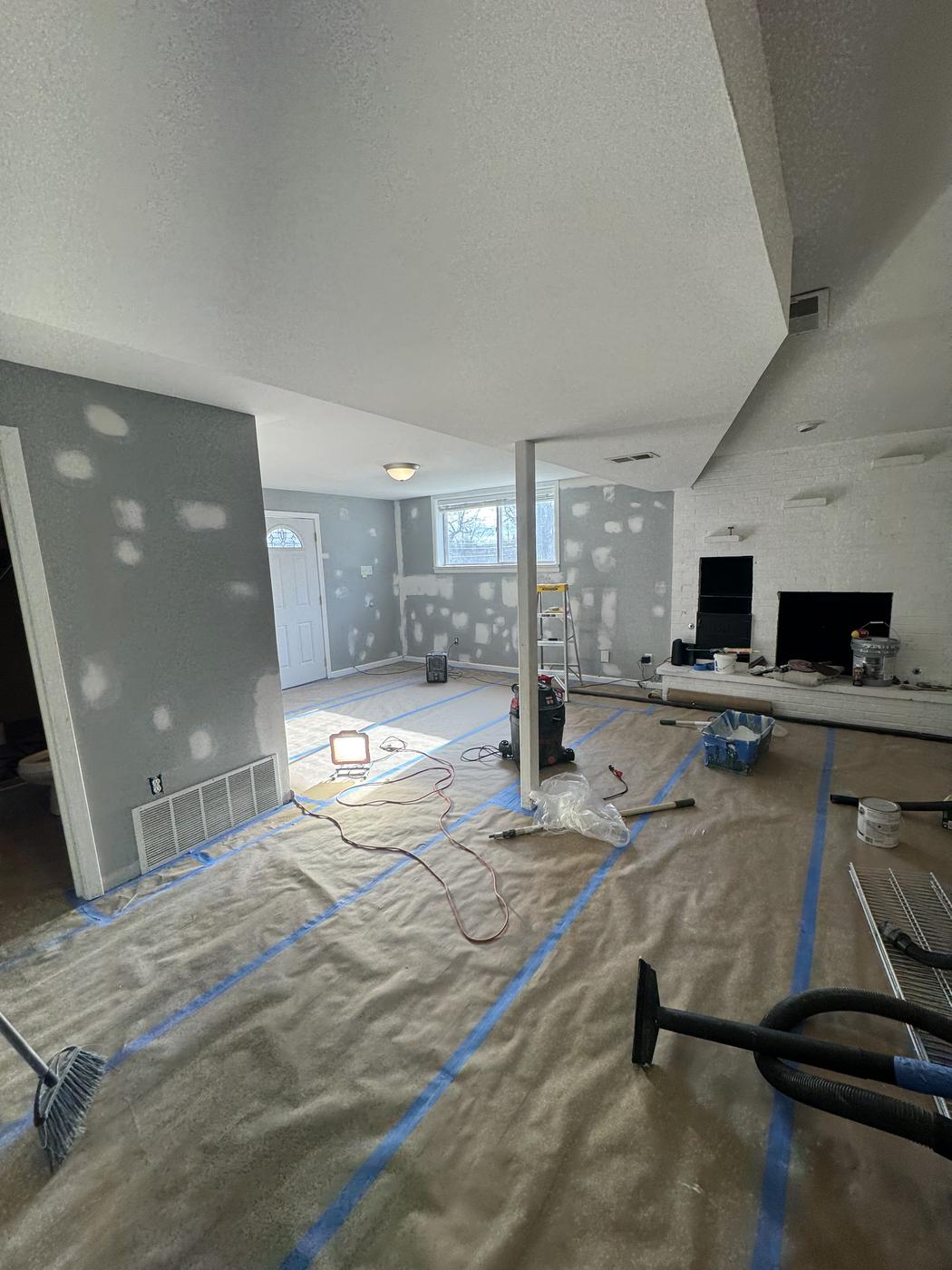 Interior wall with drywall patches primed and ready for paint