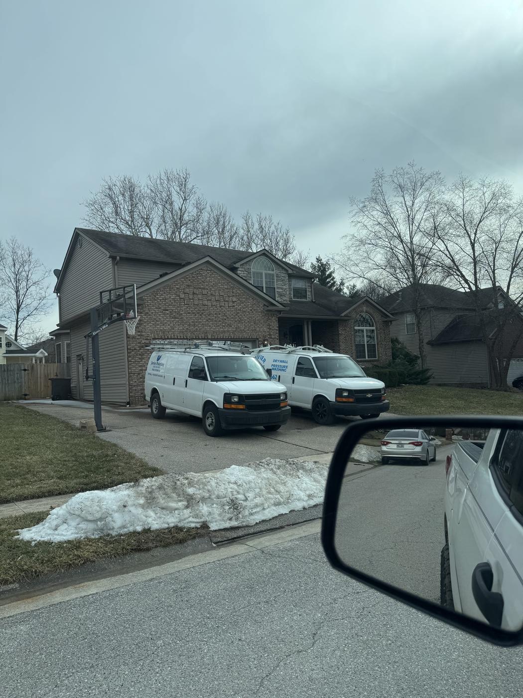 Javier Painting vans on the job even in winter weather
